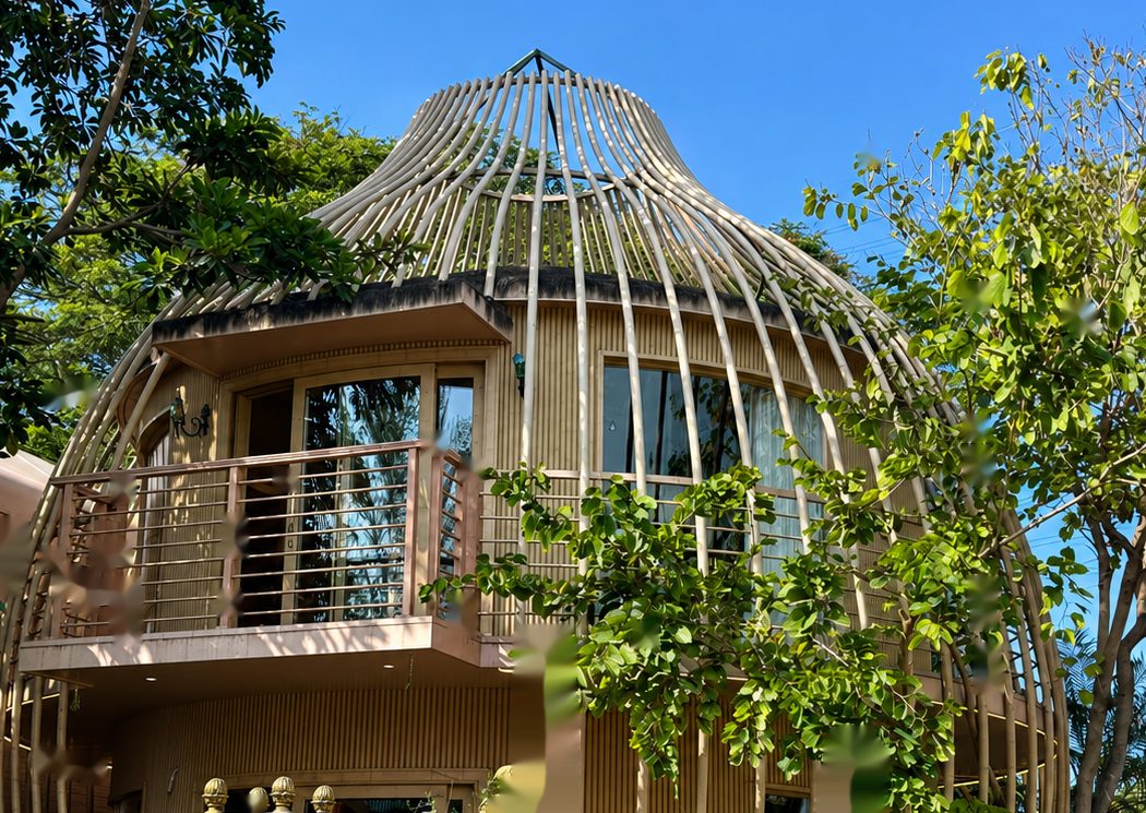 Completed two-storey Garden Seven bird-cage structure in service, showing curved lattice shell, glazing and integrated first-floor balcony